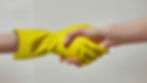 Shaking hands with latex gloves.